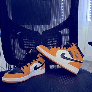 Air Jordan 1. Yellow/orange color. Like new, barely worn.